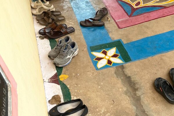 shoes lined up outside one of the ASSA buildings