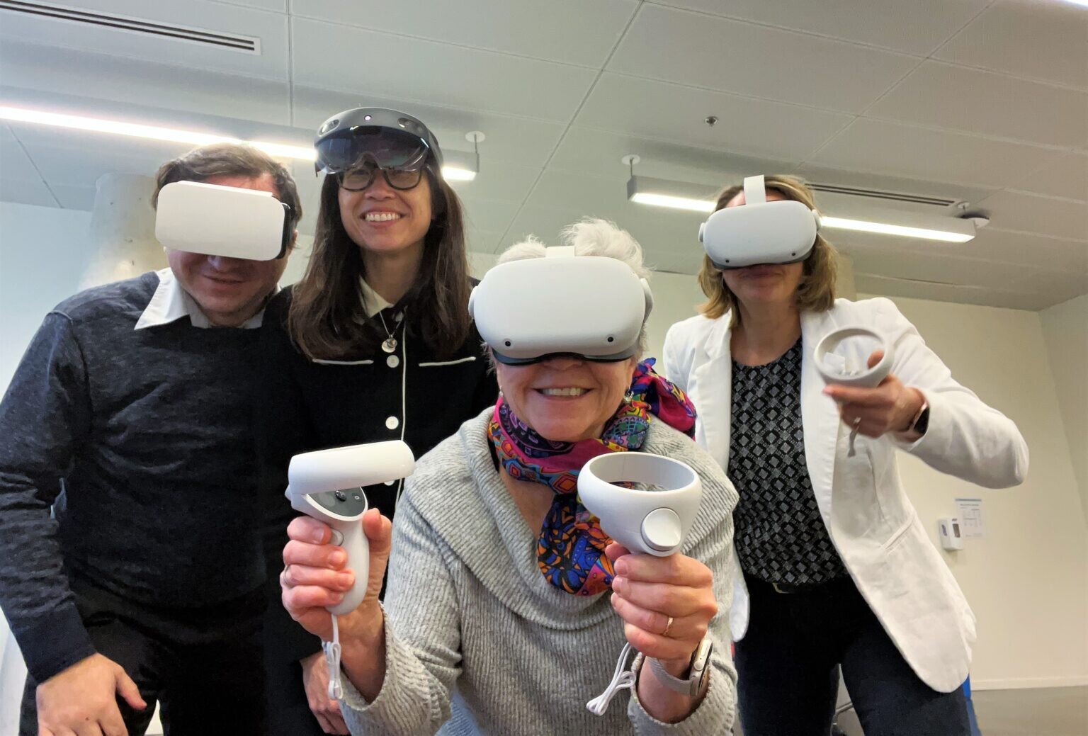 Four people in VR headsets