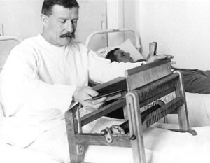 A WWI soldier weaving while convalescing
